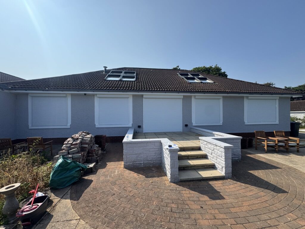 White electric roller shutters installed on a home in Leven