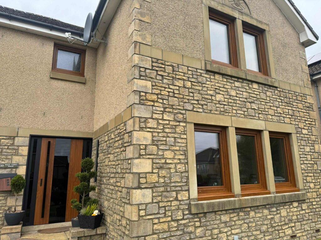 Detached home in Kirkcaldy after installation of Golden Oak triple-glazed uPVC windows and a Supertherm entrance door